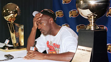 Michael Jordan of the Chicago Bulls talks to the m
