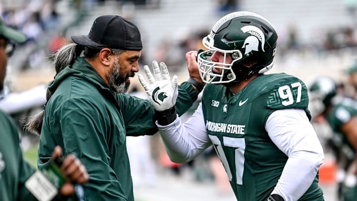 Michigan State's Maverick Hansen, right, works with defensive line coach Legi Suiaunoa during the Spring Showcase on Saturday, April 20, 2024, at Spartan Stadium in East Lansing.