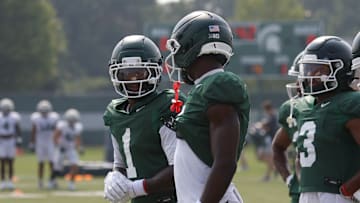 Nick Marsh (center) Omari Kelly (left)