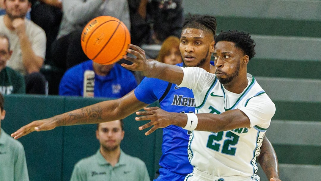 Jan 30, 2025; New Orleans, Louisiana, USA;  Tulane Green Wave guard Asher Woods (22) passes the ball against the Memphis Tigers during the first half at Avron B. Fogelman Arena in Devlin Fieldhouse.