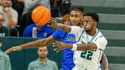 Jan 30, 2025; New Orleans, Louisiana, USA;  Tulane Green Wave guard Asher Woods (22) passes the ball against the Memphis Tigers during the first half at Avron B. Fogelman Arena in Devlin Fieldhouse.