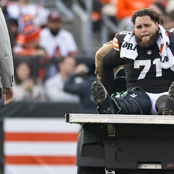 Nov 5, 2023; Cleveland, Ohio, USA; Cleveland Browns offensive tackle Jedrick Wills Jr. (71) cries as he is carted off the field following an injury during the third quarter against the Arizona Cardinals at Cleveland Browns Stadium. Mandatory Credit: Scott Galvin-Imagn Images