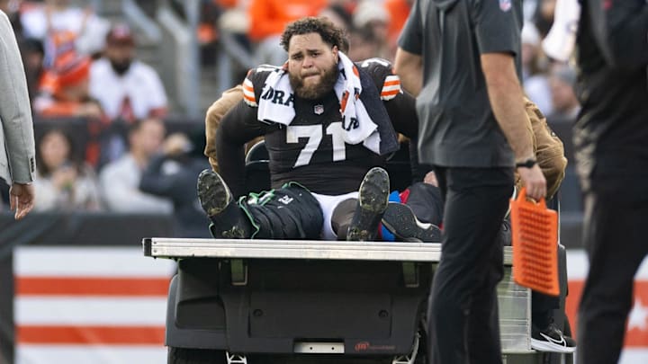 Nov 5, 2023; Cleveland, Ohio, USA; Cleveland Browns offensive tackle Jedrick Wills Jr. (71) cries as he is carted off the field following an injury during the third quarter against the Arizona Cardinals at Cleveland Browns Stadium. Mandatory Credit: Scott Galvin-Imagn Images