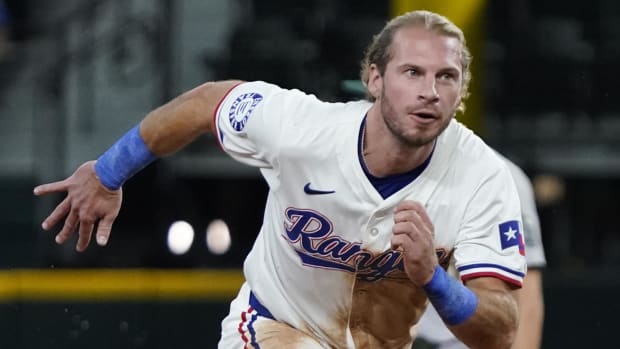 Texas Rangers outfielder Travis Jankowski stole his 100th career base in the second inning on Saturday.