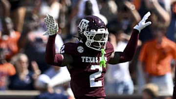 Sep 27, 2025; College Station, Texas, USA; Texas A&M Aggies cornerback Dezz Ricks (2) motion during the first half against the Auburn Tigers at Kyle Field. Mandatory Credit: Maria Lysaker-Imagn Images 
