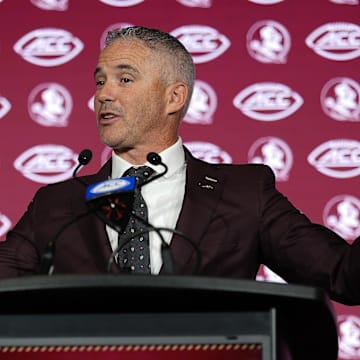 Jul 23, 2025; Charlotte, NC, USA; aFlorida State head coach Mike Norvell answers questions from the media during ACC Media days at Hilton Charlotte Uptown. Mandatory Credit: Jim Dedmon-Imagn Images