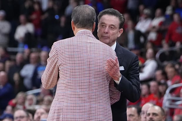 Pitino shakes hands with Calipari at the end of their second-round NCAA tournament game.