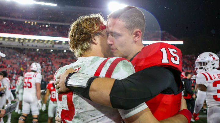 Nov 11, 2023; Athens, Georgia, USA; Mississippi Rebels quarterback Jaxson Dart (2) and Georgia Bulldogs quarterback Carson Beck (15) hug after a game at Sanford Stadium. Mandatory Credit: Brett Davis-USA TODAY Sports