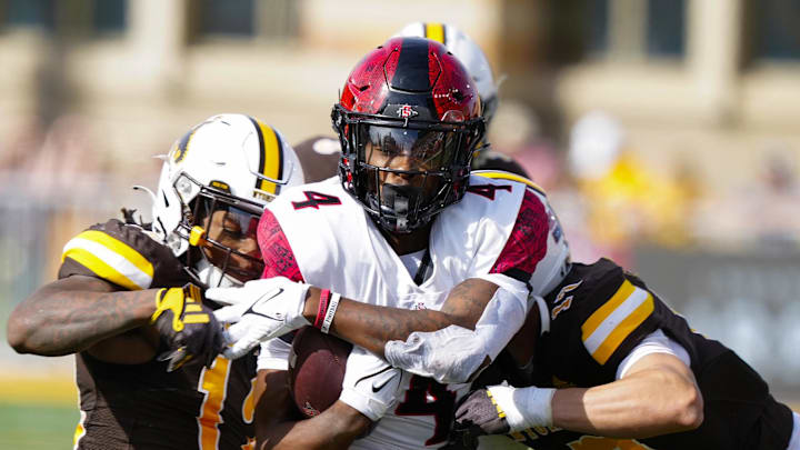 Oct 12, 2024; Laramie, Wyoming, USA; San Diego State Aztecs wide receiver Louis Brown IV (4) runs against the Wyoming Cowboys during the second quarter at Jonah Field at War Memorial Stadium. Mandatory Credit: Troy Babbitt-Imagn Images