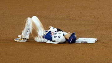 Oct 26, 2024; Los Angeles, California, USA; Los Angeles Dodgers designated hitter Shohei Ohtani (17) reacts after injuring his shoulder against the New York Yankees in the seventh inning for game two of the 2024 MLB World Series at Dodger Stadium. Mandatory Credit: Kiyoshi Mio-Imagn Images