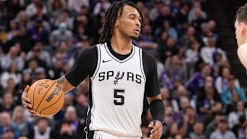 Mar 7, 2025; Sacramento, California, USA; San Antonio Spurs guard Stephon Castle (5) controls the ball against the Sacramento Kings during the fourth quarter at Golden 1 Center. Mandatory Credit: Ed Szczepanski-Imagn Images