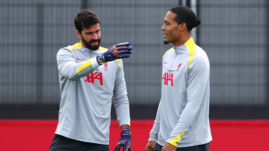 Alisson (left) and Virgil van Dijk.