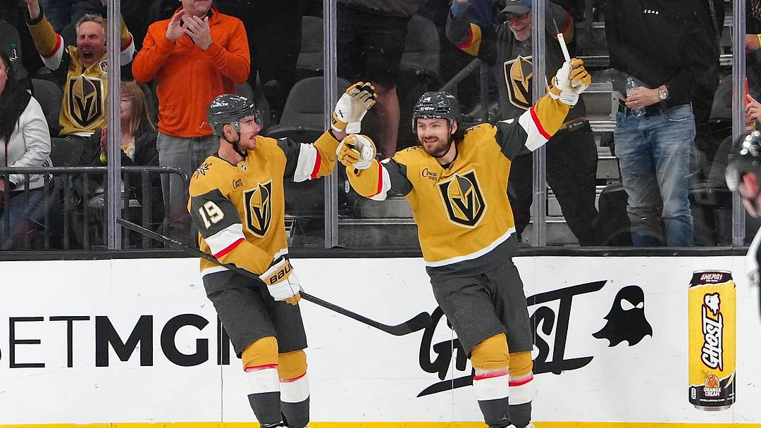 Mar 30, 2026; Las Vegas, Nevada, USA; Vegas Golden Knights defenseman Rasmus Andersson (4) celebrates with  right wing Reilly Smith (19) after scoring a goal against the Vancouver Canucks during the second period at T-Mobile Arena. Mandatory Credit: Stephen R. Sylvanie-Imagn Images