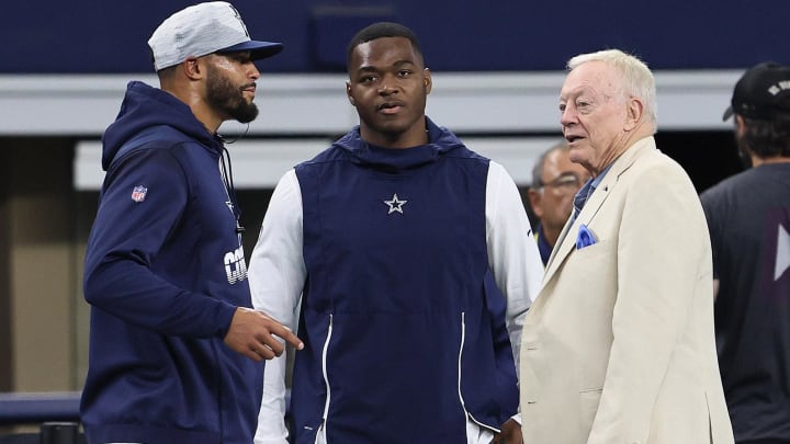 Aug 29, 2021; Arlington, Texas, USA; Dallas Cowboys quarterback Dak Prescott , owner Jerry Jones and receiver Amari Cooper talk prior to the game against the Jacksonville Jaguars at AT&T Stadium. Mandatory Credit: Matthew Emmons-USA TODAY Sports