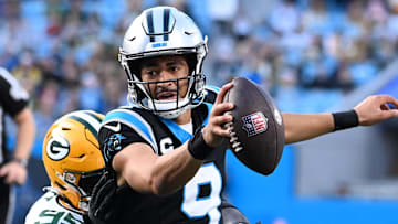 Carolina Panthers quarterback Bryce Young (9) scrambles against the Green Bay Packers in 2023.