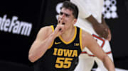 Mar 13, 2021; Indianapolis, Indiana, USA; Iowa Hawkeyes center Luka Garza (55) reacts to the crowd after making a shot against the Illinois Fighting Illini in the first half at Lucas Oil Stadium. Mandatory Credit: Aaron Doster-Imagn Images