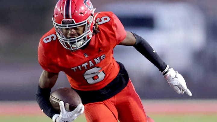 Carl Albert's Trystan Haynes gets by Bishop McGuinness' Andrew Elder during the high school football game between Carl Albert and Bishop McGuinness at Carl Albert High School in Midwest City, Okla., Friday, Oct., 13, 2023.