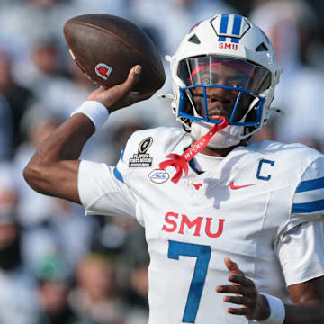 Dec 21, 2024; University Park, Pennsylvania, USA; Southern Methodist Mustangs quarterback Kevin Jennings (7) throws an interception to Penn State Nittany Lions linebacker Tony Rojas (not pictured) during the first half at Beaver Stadium. Mandatory Credit: Vincent Carchietta-Imagn Images