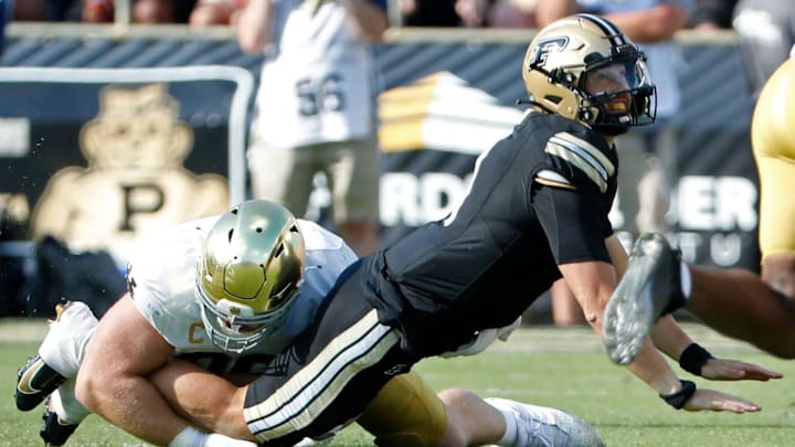 Purdue Boilermakers quarterback Hudson Card (1) is hit as his pass is intercepted by Notre Dame Fighting Irish defensive lineman Boubacar Traore (5) Saturday, Sept. 14, 2024, during the NCAA football game at Ross-Ade Stadium in West Lafayette, Ind.