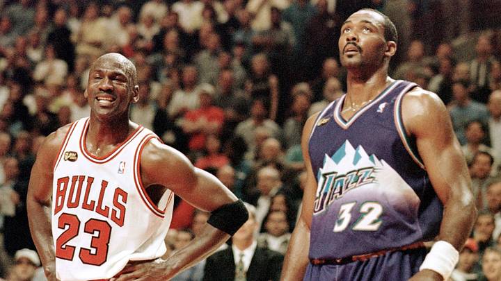 Michael Jordan (L) of the Chicago Bulls smiles whi