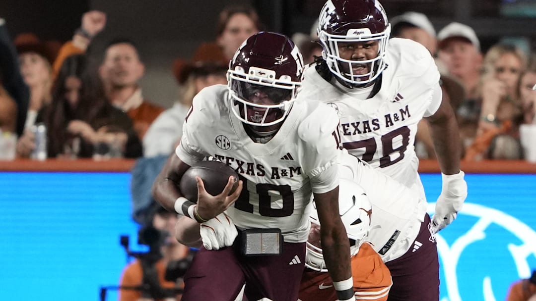Texas A&M Aggies quarterback Marcel Reed keeps the ball for yards during the first half against the Texas Longhorns at Darrell K Royal-Texas Memorial Stadium.