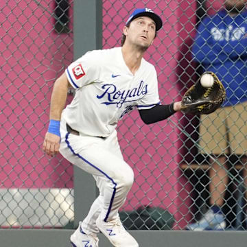 Oct 9, 2024; Kansas City, Missouri, USA; Kansas City Royals second base Adam Frazier (26) makes catch in the third inning against the New York Yankees during game three of the NLDS for the 2024 MLB Playoffs at Kauffman Stadium. Mandatory Credit: Jay Biggerstaff -Imagn Images