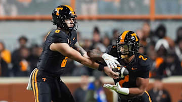 Tennessee quarterback Joey Aguilar (6) hand the ball to Tennessee running back Peyton Lewis (2) warm-ups before a NCAA football game between the Tennessee Volunteers and Oklahoma Sooners at Neyland Stadium in Knoxville, Tenn., on November 1, 2025.
