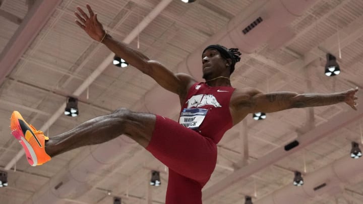 Wayne Pinnock of Arkansas wins the long jump at 27-6 3/4 (8.40m) during the NCAA Indoor Track and Field Championships  He finished with an Olympic Silver in Paris with a jump of 8.36 meters.