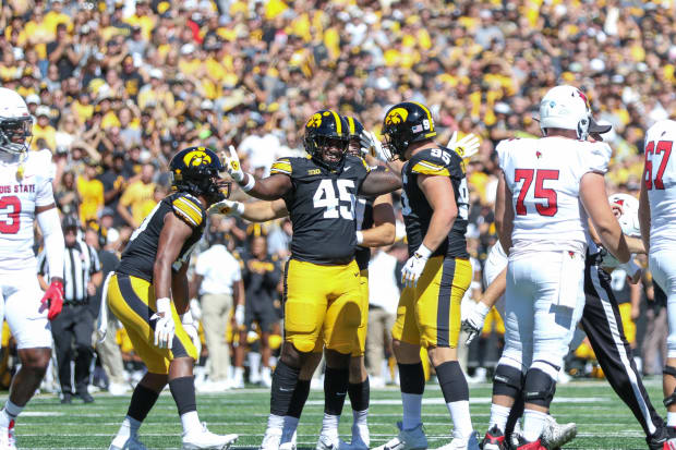 Iowa's Deontae Craig (45) celebrates a sack with teammate Aaron Graves (95). (Photo: Rob Howe/HN) 