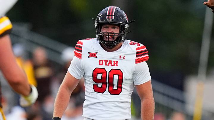 Sep 13, 2025; Laramie, Wyoming, USA; Utah Utes defensive end John Henry Daley (90) celebrates his sack in the first quarter against the Wyoming Cowboys at Jonah Field at War Memorial Stadium. Mandatory Credit: Ron Chenoy-Imagn Images