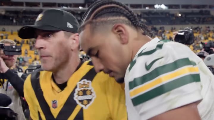 Jordan Love and Aaron Rodgers met at midfield after the Packers beat the Steelers in Pittsburgh on Sunday night. 