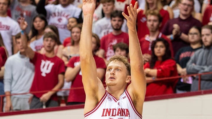 Indiana's Tucker DeVries (12) makes a three-pointer during the Indiana versus Marian men's basketball game at Simon Skjodt Assembly Hall on Friday, Oct. 17, 2025.