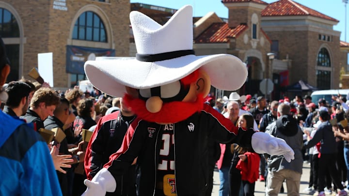 Nov 9, 2024; Lubbock, Texas, USA; The Texas Tech Red Raiders mascot greets fans before the the game between the Texas Tech Red Raiders and the Colorado Buffalos at Jones AT&T Stadium and Cody Campbell Field. Mandatory Credit: Michael C. Johnson-Imagn Images