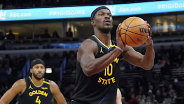 Feb 8, 2025; Chicago, Illinois, USA; Golden State Warriors forward Jimmy Butler (10) shoots a free throw against the Chicago Bulls during the first half at United Center. Mandatory Credit: David Banks-Imagn Images