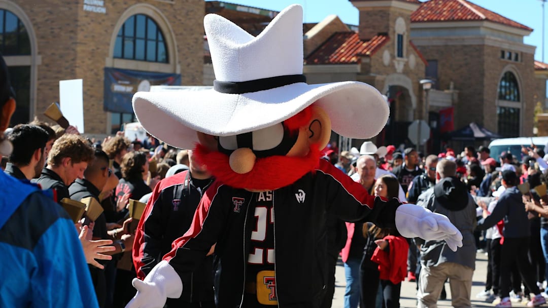Nov 9, 2024; Lubbock, Texas, USA; The Texas Tech Red Raiders mascot greets fans before the the game between the Texas Tech Red Raiders and the Colorado Buffalos at Jones AT&T Stadium and Cody Campbell Field. Mandatory Credit: Michael C. Johnson-Imagn Images