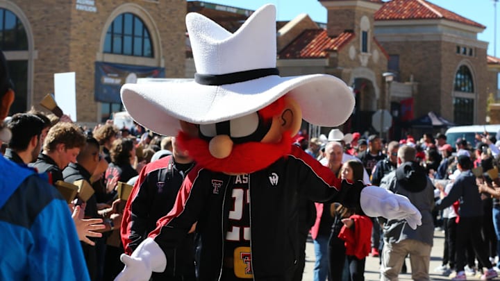 Nov 9, 2024; Lubbock, Texas, USA; The Texas Tech Red Raiders mascot greets fans before the the game between the Texas Tech Red Raiders and the Colorado Buffalos at Jones AT&T Stadium and Cody Campbell Field. Mandatory Credit: Michael C. Johnson-Imagn Images