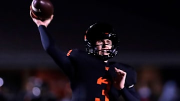 West De Pere's Patrick Greisen (3) looks to pass during a WIAA Division 2 first-round playoff game versus Hartford on Oct. 24, 2025.