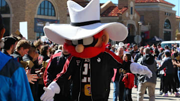 Nov 9, 2024; Lubbock, Texas, USA; The Texas Tech Red Raiders mascot greets fans before the the game between the Texas Tech Red Raiders and the Colorado Buffalos at Jones AT&T Stadium and Cody Campbell Field. Mandatory Credit: Michael C. Johnson-Imagn Images