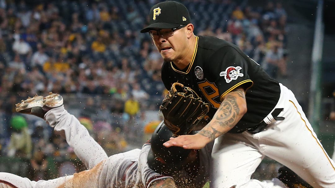 David Peralta slides to score a run on a wild pitch by Pittsburgh Pirates relief pitcher Anthony Banda.