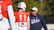 Auburn Tigers head coach Hugh Freeze works with new quarterback Jackson Arnold at spring practice.