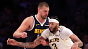 Nov 23, 2024; Los Angeles, California, USA;  Los Angeles Lakers forward Anthony Davis (3) posts up against Denver Nuggets center Nikola Jokic (15) during the first half at Crypto.com Arena.