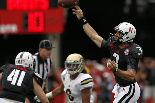 Nebraska Cornhuskers quarterback Taylor Martinez (3) passes against the UCLA Bruins in the third quarter at Memorial Stadium.