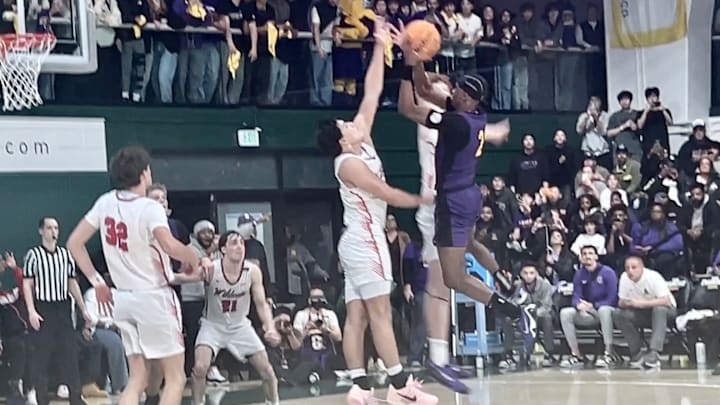 USF-signee Andrew Hilman goes up over two defenders to make a game-winning shot for Riordan over Riordan at War Memorial Gym on the campus of USF. USF-signee Andrew Hilman goes up over two defenders to make a game-winning shot for Riordan over Riordan at War Memorial Gym on the campus of USF.