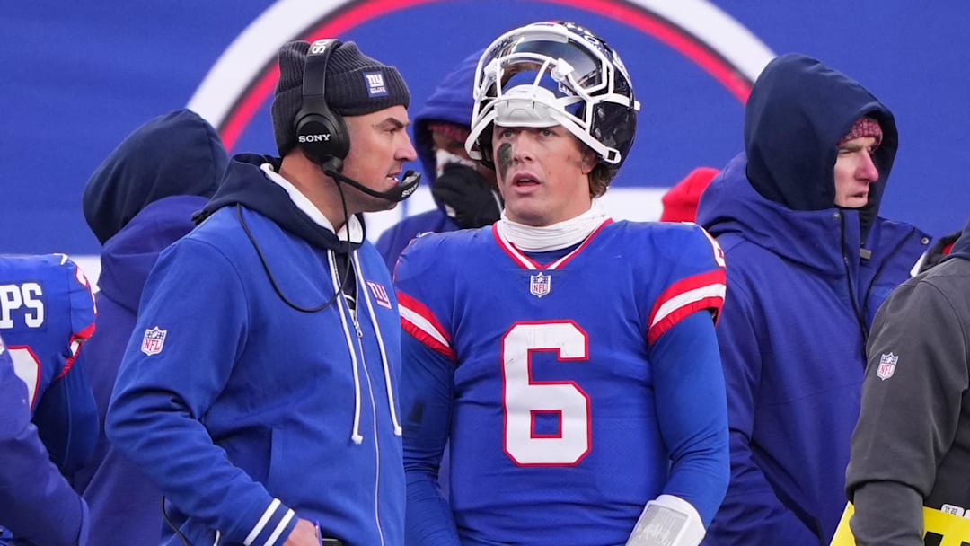 Dec 14, 2025; East Rutherford, New Jersey, USA;  New York Giants quarterback Jaxson Dart (6) talks with interim head coach Mike Kafka during the fourth quarter against the Washington Commanders at MetLife Stadium. Mandatory Credit: Robert Deutsch-Imagn Images