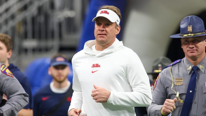 Dec 30, 2023; Atlanta, GA, USA; Mississippi Rebels head coach Lane Kiffin runs on the field before a game against the Penn State Nittany Lions at Mercedes-Benz Stadium. Mandatory Credit: Brett Davis-USA TODAY Sports
