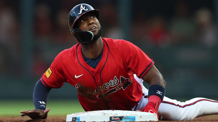 Aug 8, 2025; Cumberland, Georgia, USA; Atlanta Braves left fielder Jurickson Profar (7) steals second base against the Miami Marlins during the third inning at Truist Park. Mandatory Credit: Mady Mertens-Imagn Images