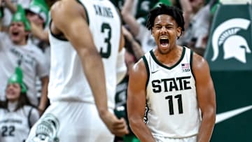 Michigan State's A.J. Hoggard, right, celebrates with Jaden Akins after Akins' 3-pointer against
