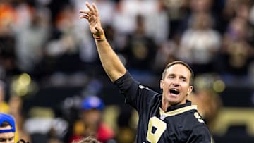 Oct 17, 2024; New Orleans, Louisiana, USA;  Former New Orleans Saints quarterback Drew Brees on the field for the coin toss against the Denver Broncos during the first half at Caesars Superdome. Mandatory Credit: Stephen Lew-Imagn Images