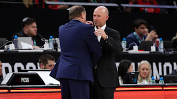Mar 14, 2024; Minneapolis, MN, USA; Maryland Terrapins head coach Kevin Willard and Wisconsin Badgers head coach Greg Gard shake hands after the game at Target Center.