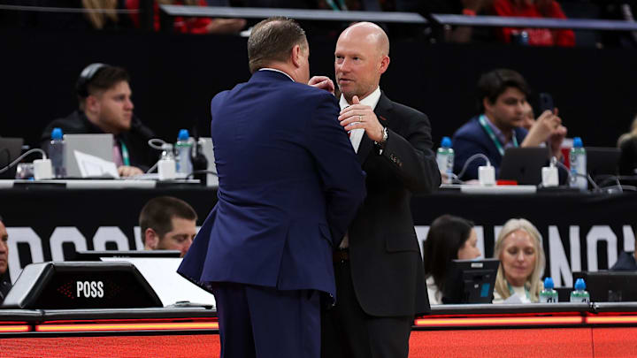 Mar 14, 2024; Minneapolis, MN, USA; Maryland Terrapins head coach Kevin Willard and Wisconsin Badgers head coach Greg Gard shake hands after the game at Target Center. Mar 14, 2024; Minneapolis, MN, USA; Maryland Terrapins head coach Kevin Willard and Wisconsin Badgers head coach Greg Gard shake hands after the game at Target Center.